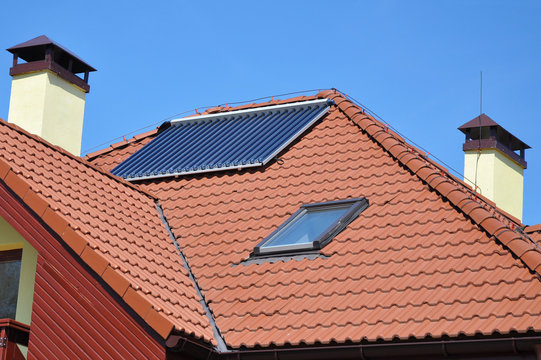Ceramic roof tiles  with roof window, skylight, solar panel, vacuum solar water heating system, chimney and Lightning Protection System&lrm;. Lightning rod.