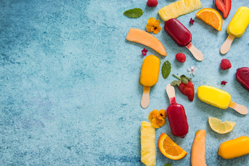 Mixed homemade popsicle and fruits