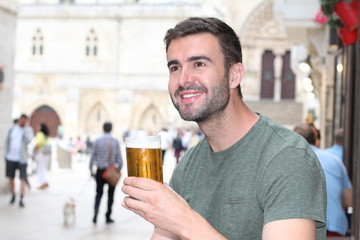 Man taking a break with a cold refreshing beer 