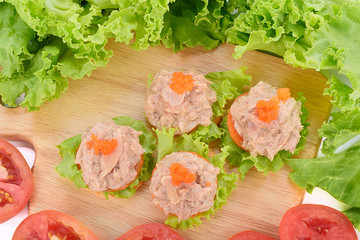 Tuna salad on biscuit and vegetable isolated on white background.