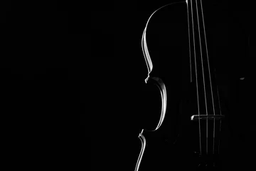 Zelfklevend Fotobehang Violin classical music instrument close-up. Stringed musical instrument violin isolated on black background with copy space. Classical orchestra instruments fiddle close up © Gecko Studio