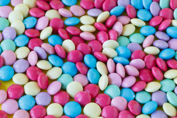 Rainbow multicolored gumballs chewing gums as background