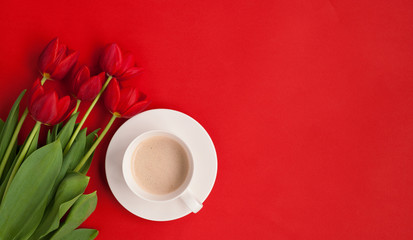 Coffee cup and bright flowers