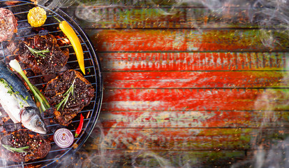 Barbecue grill with beef steaks, close-up.