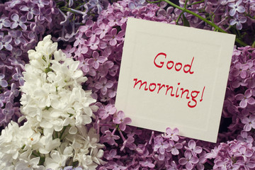 Good morning! Bouquet of a lilac and the white card with the inscription "Good morning!"