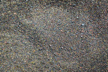 Black volcanic sand on the beach of Sao Miguel.
