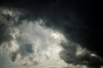 Naklejka na ściany i meble Background of dark clouds before a thunderstorm