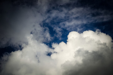 Dramatic sky. Saturated clouds before a thunderstorm, against the background of a blue sky.
