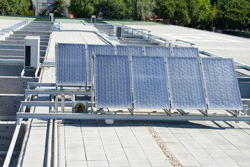 Solar panels over a building roof.