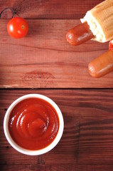 Two hot dogs with ketchup