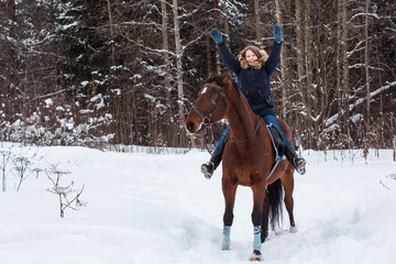 Fototapeta na wymiar Girl teenager and big horse in a winter