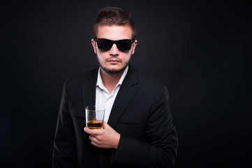 Handsome exclusive man drinking alcohol