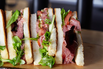 Fresh and tasty sandwich on wooden table