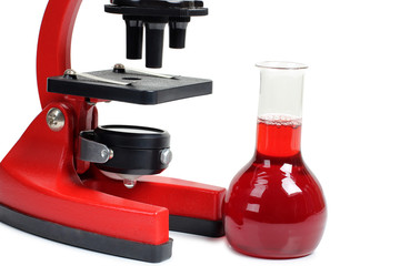 Microscope for biology and flasks on white background
