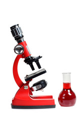 Microscope for biology and flasks on white background