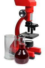 Microscope for biology and flasks on white background