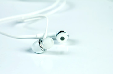 selective focus of earphones on white background