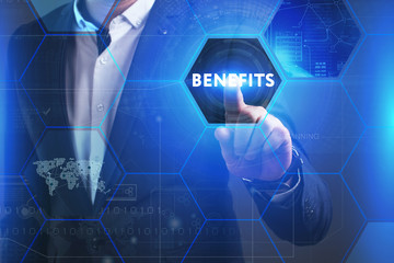 Business, Technology, Internet and network concept. Young businessman working on a virtual screen of the future and sees the inscription: Benefits
