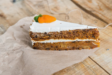 Piece of carrot cake on paper