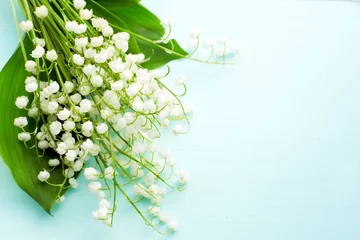Wall murals Lily of the valley Bouquet of fresh white lilies of the valley in a wooden window still. Top view