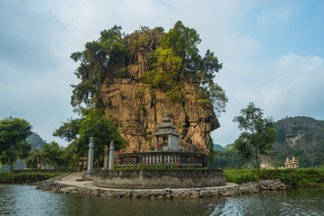 Fototapeta na wymiar Pagoda in Tam Coc River, Ninh Binh, Vietnam
