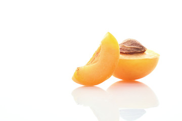 Fototapeta na wymiar Fresh cut apricot fruits on white background
