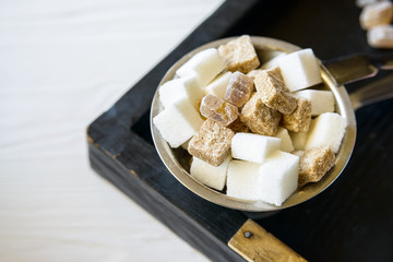 Lumps of white and brown sugar in restaurant