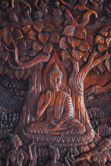 Buddha Image Wood Engraving on the door at Wat Asokara Temple in Thailand