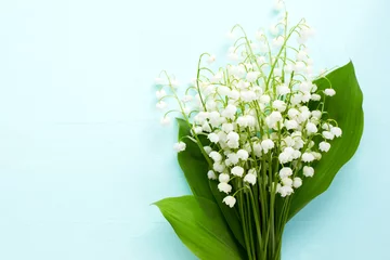 Washable wall murals Lily of the valley Bouquet of fresh white lilies of the valley in a wooden window still. Top view
