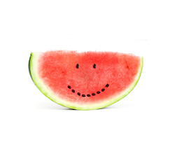 Slice of watermelon with seeds that make a smiling face