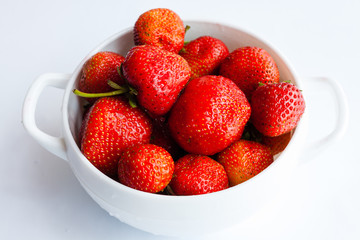 Tasty strawberries fruit in bowl. Strawberries top view.