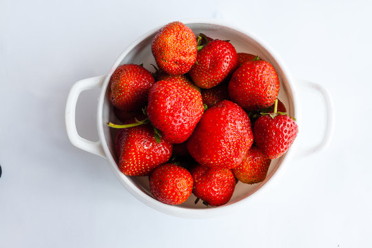 Tasty strawberries fruit in bowl. Strawberries top view.