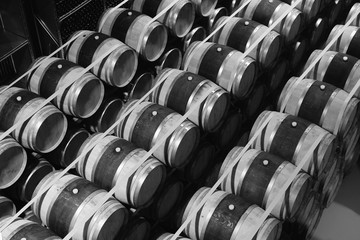 Naklejka na ściany i meble Oak wine barells stacked in modern winery. View from above