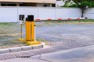 Automatic rising arm access barrier of buiding car park.