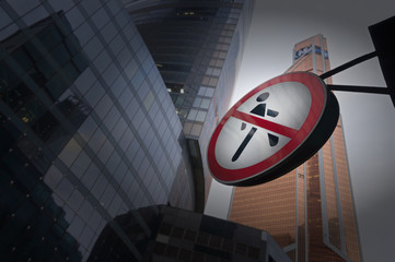 Road Sign Pedestrians are forbidden to pass among the skyscrapers