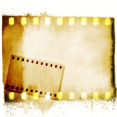Yellow film strip frames on dripping background.