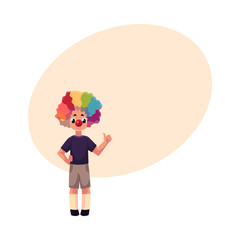Little boy wearing clown nose and rainbow colored wig showing thumb up, cartoon vector illustration with space for text. Full length portrait of little boy wearing clown red nose and wig