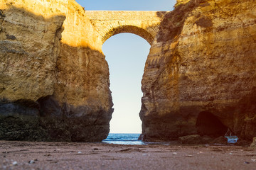 The Praia da Batata bridge at sunset in Lagos, Portugal