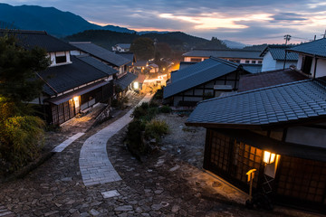 Fototapeta na wymiar Japan rural town Magome after the sunset wooden houses and street lamps