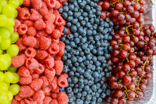 Fresh organic pomegranate seeds, blackberries, raspberries, blueberries and strawberries