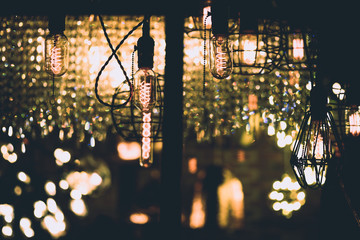 Decorative antique vintage edison style filament light bulbs in room