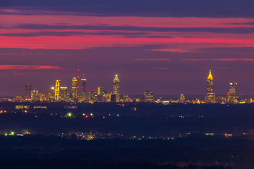 The beautiful view of illuminated Midtown Atlanta from the Stone Mountain at twilight with red sky, Georgia, USA