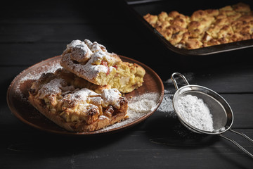 Rustic style pie iced with sugar powder