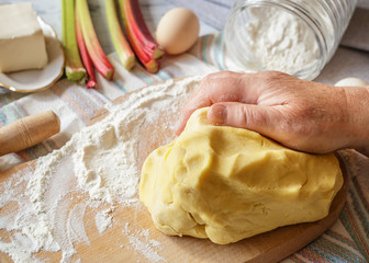 Prepared dough for rhubarb pie with ingredients