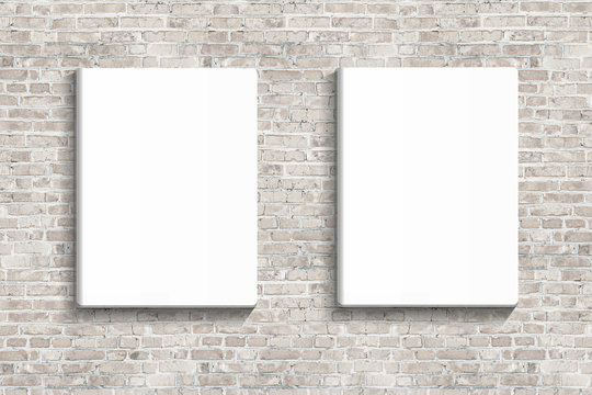 Two blank posters hanging on brick white wall of broken painted brick, mock up