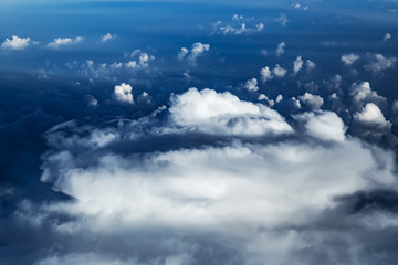 Fototapeta na wymiar White clouds, view from above air plane window