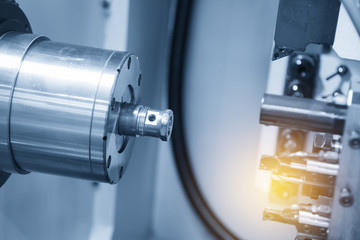 CNC lathe machine / Turning machine cutting the screw thread .Hi-precision CNC machining concept.