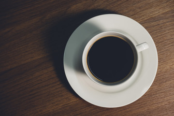 Coffee Cup on Wood Table. Top View with Copyspace for your text