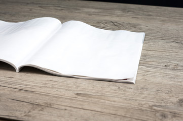 Close up shot of a blank magazine on table