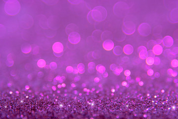 Violet or purple bokeh light is the soft blurred circles of light white and light purple . Winter Christmas and valentine background  wallpaper concept